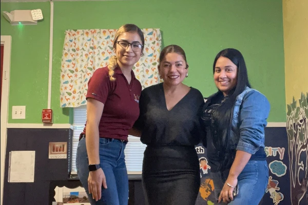 daycare teacher smiling child classroom
